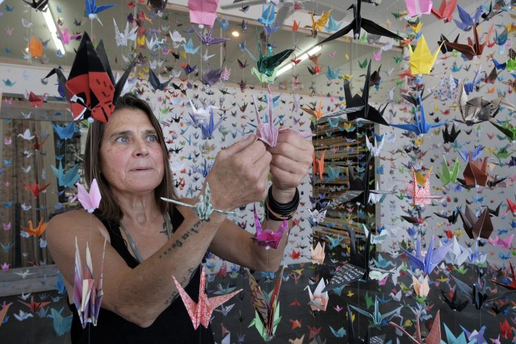 Artist creates origami crane memorials for COVID-19 victims